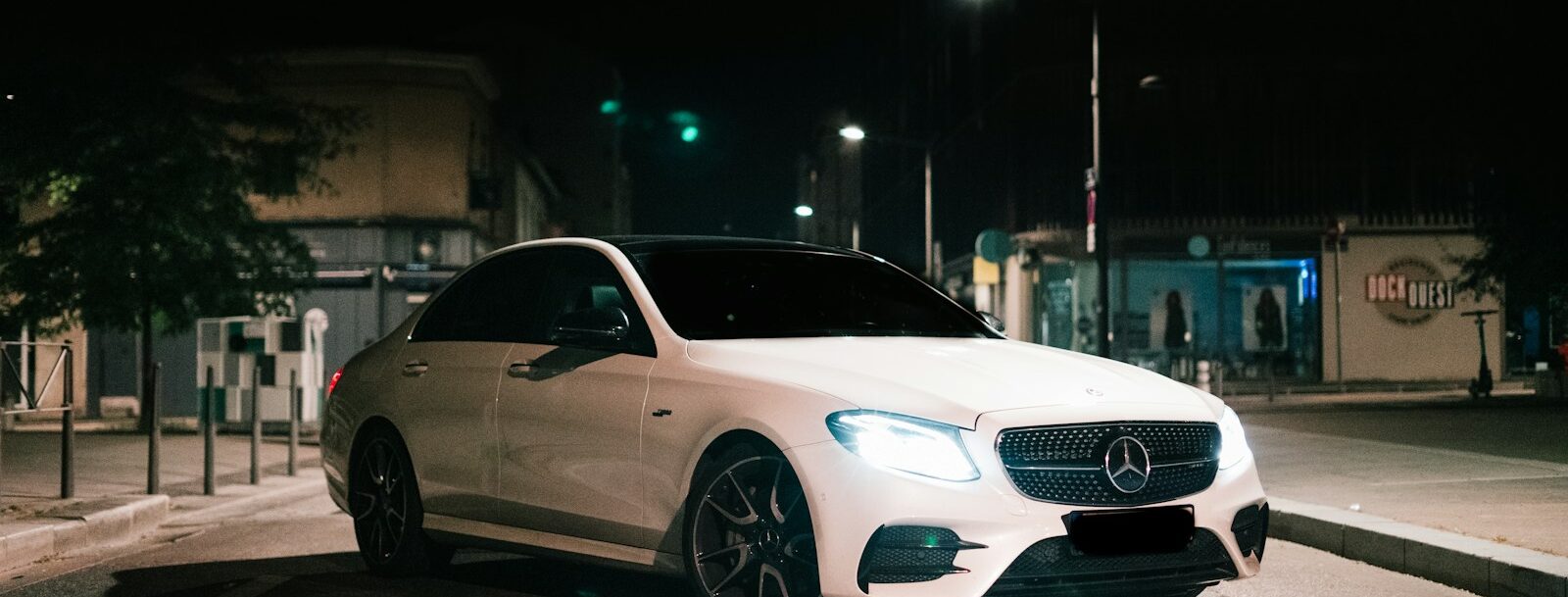 white mercedes benz coupe on road during night time